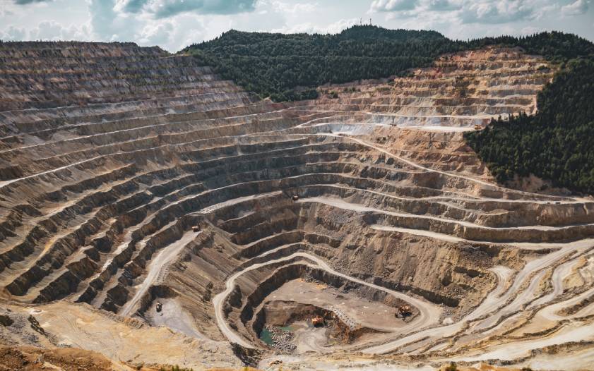 A large open pit with many levels of rock.